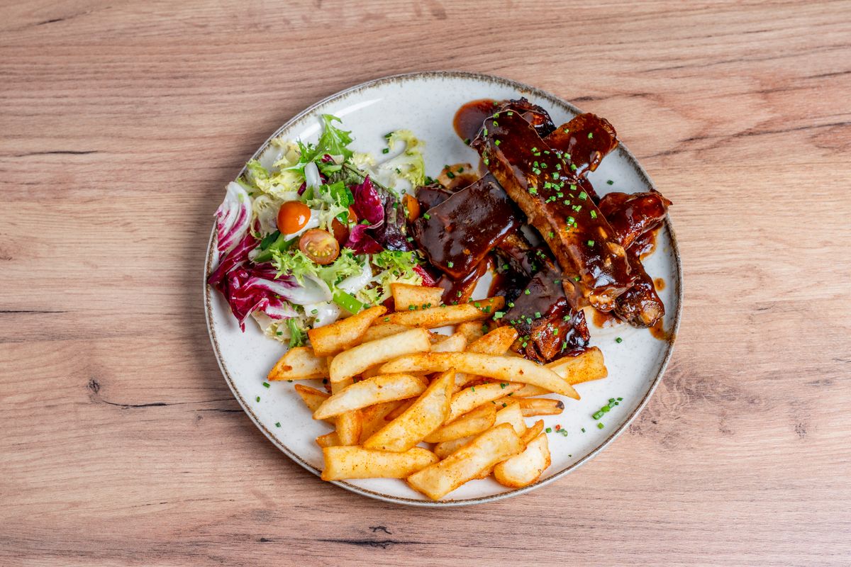 Barbecue ribs with fries and salad
